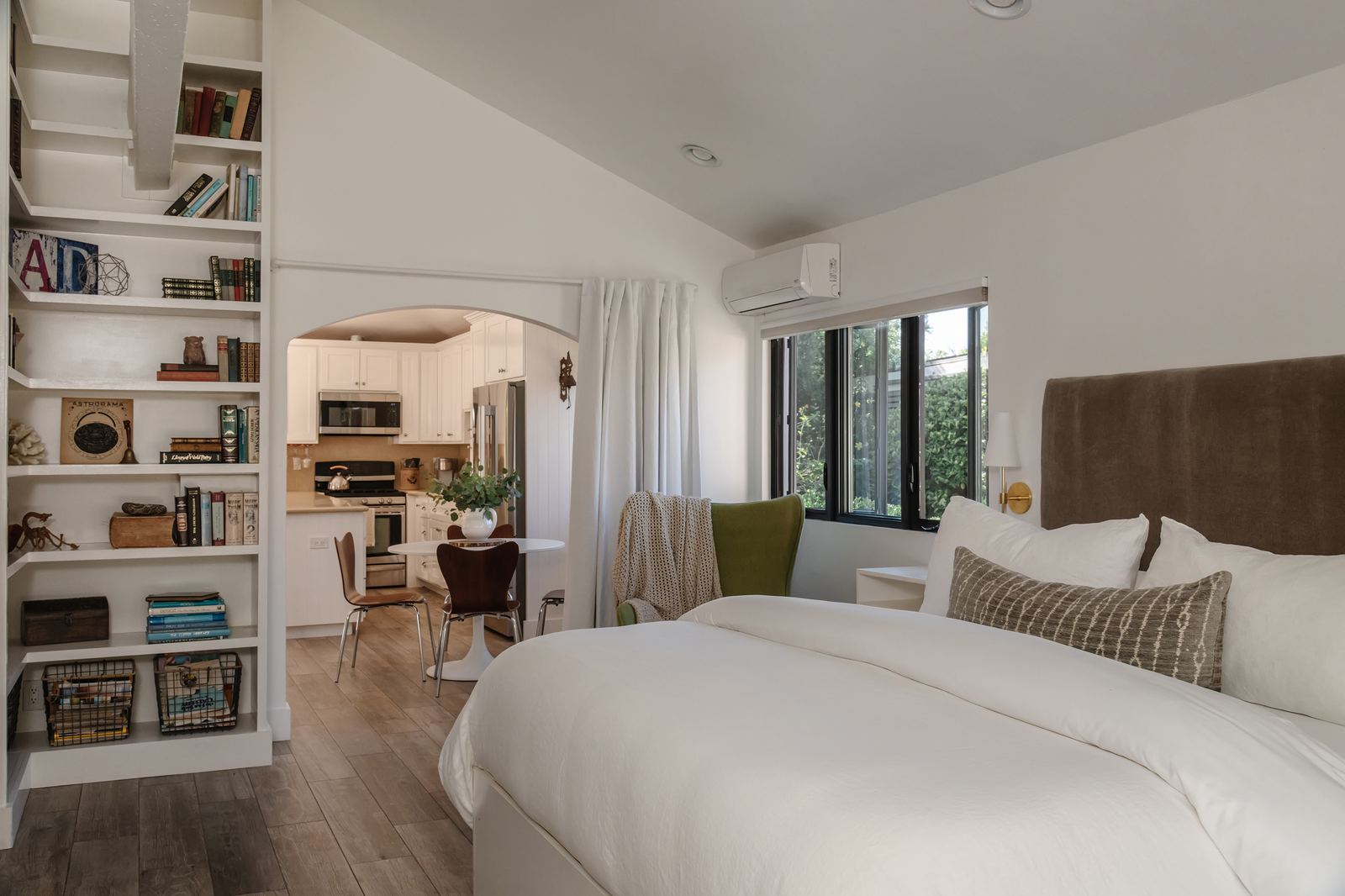 Bedroom with view to dining nook and kitchen
