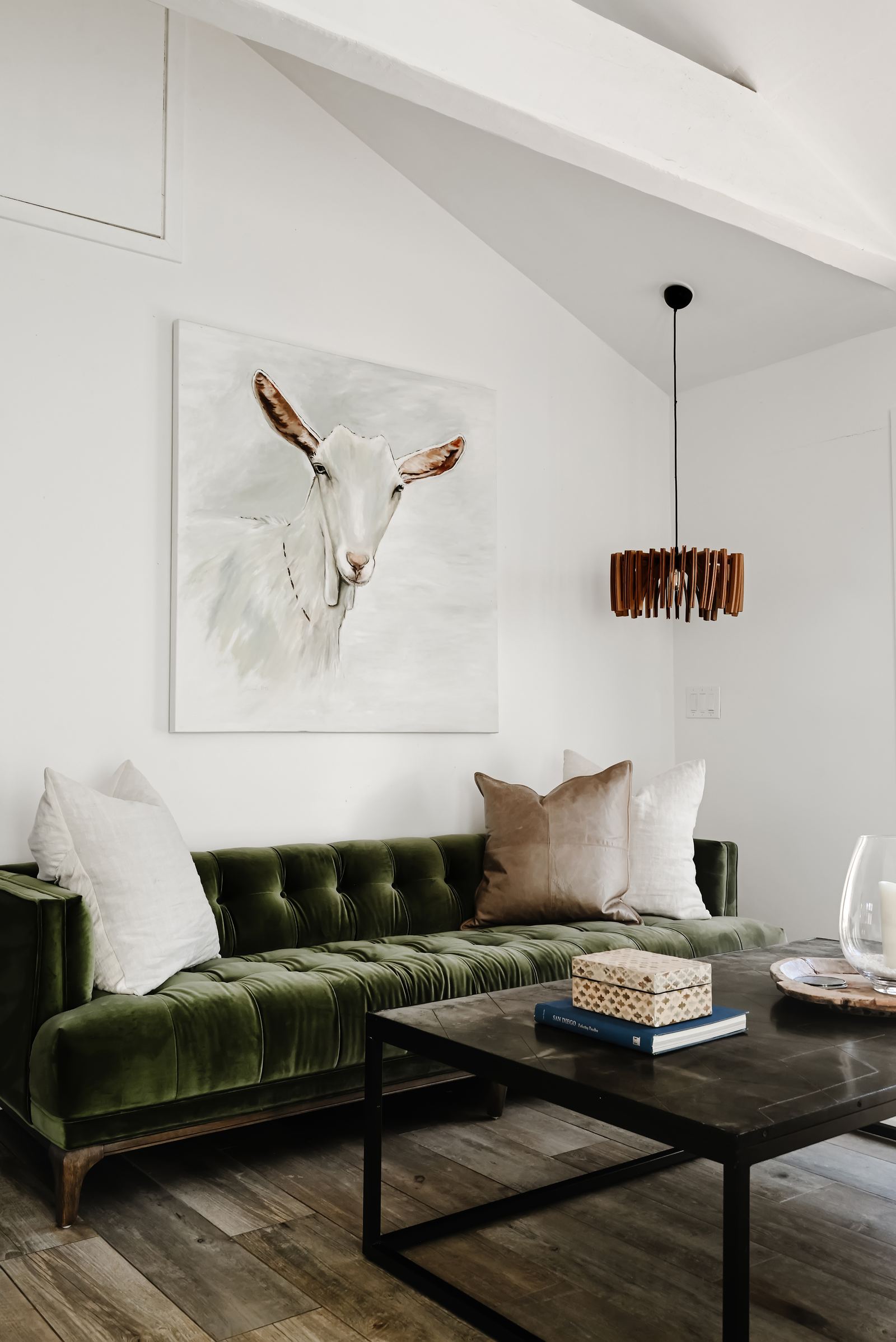 Living room with sofa and goat painting