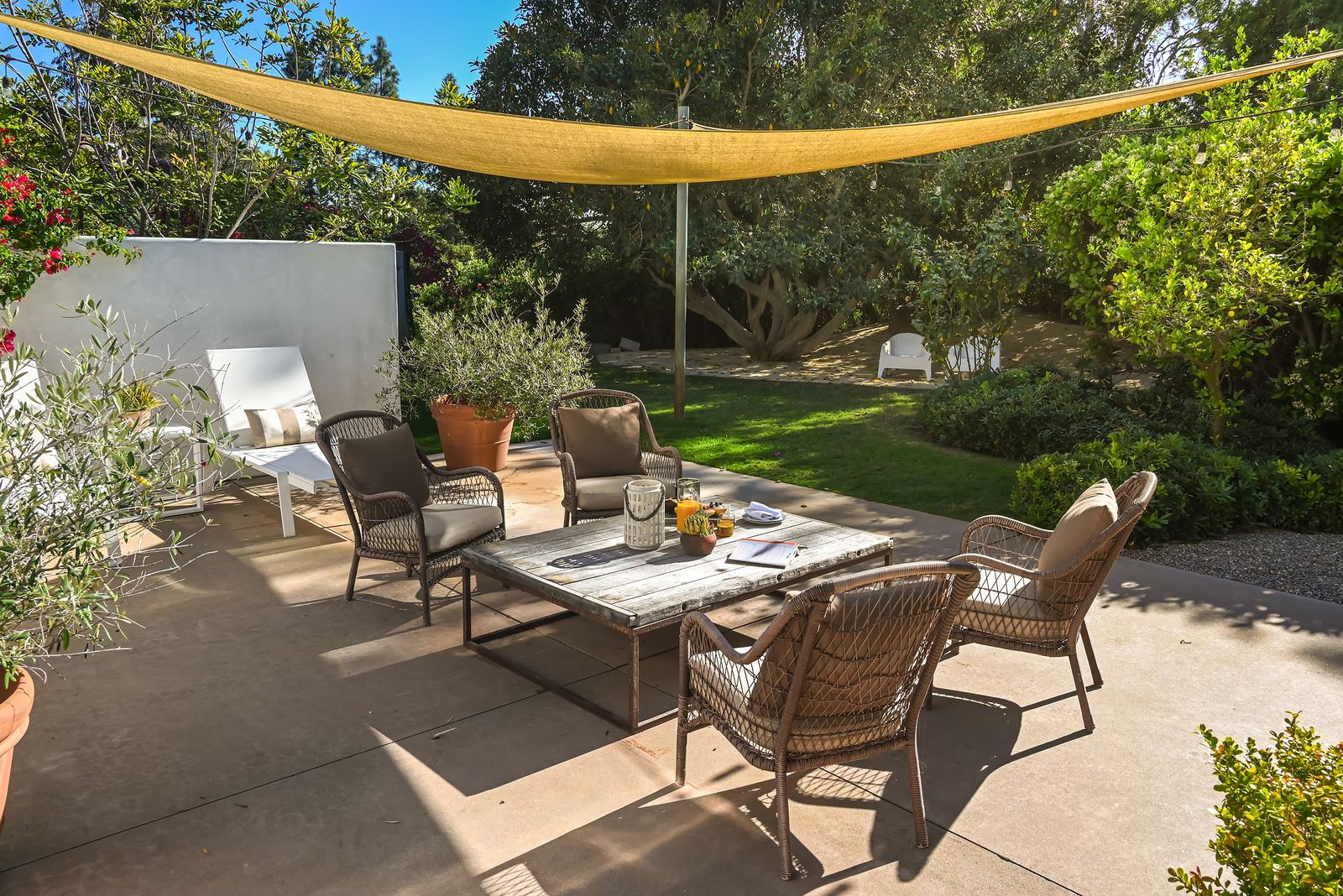 Private patio with shade sail and seating